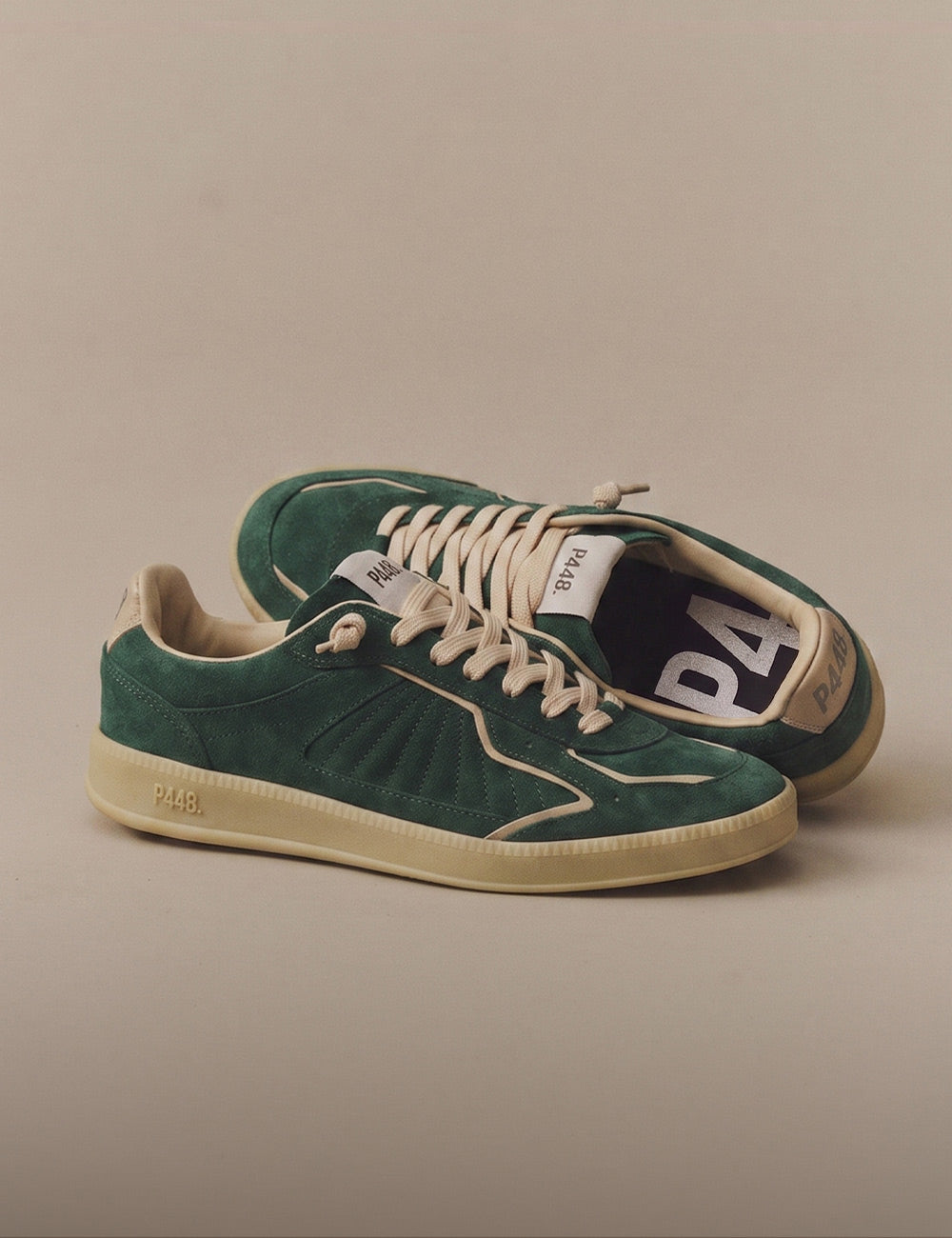 P448 men's sneaker in forest green suede with beige laces, cream piping, and a matching sole on a neutral background.