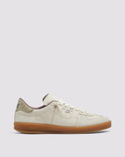 Side angle of white and green sneakers