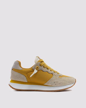 Side angle of mustard/white and yellow/grey sneakers