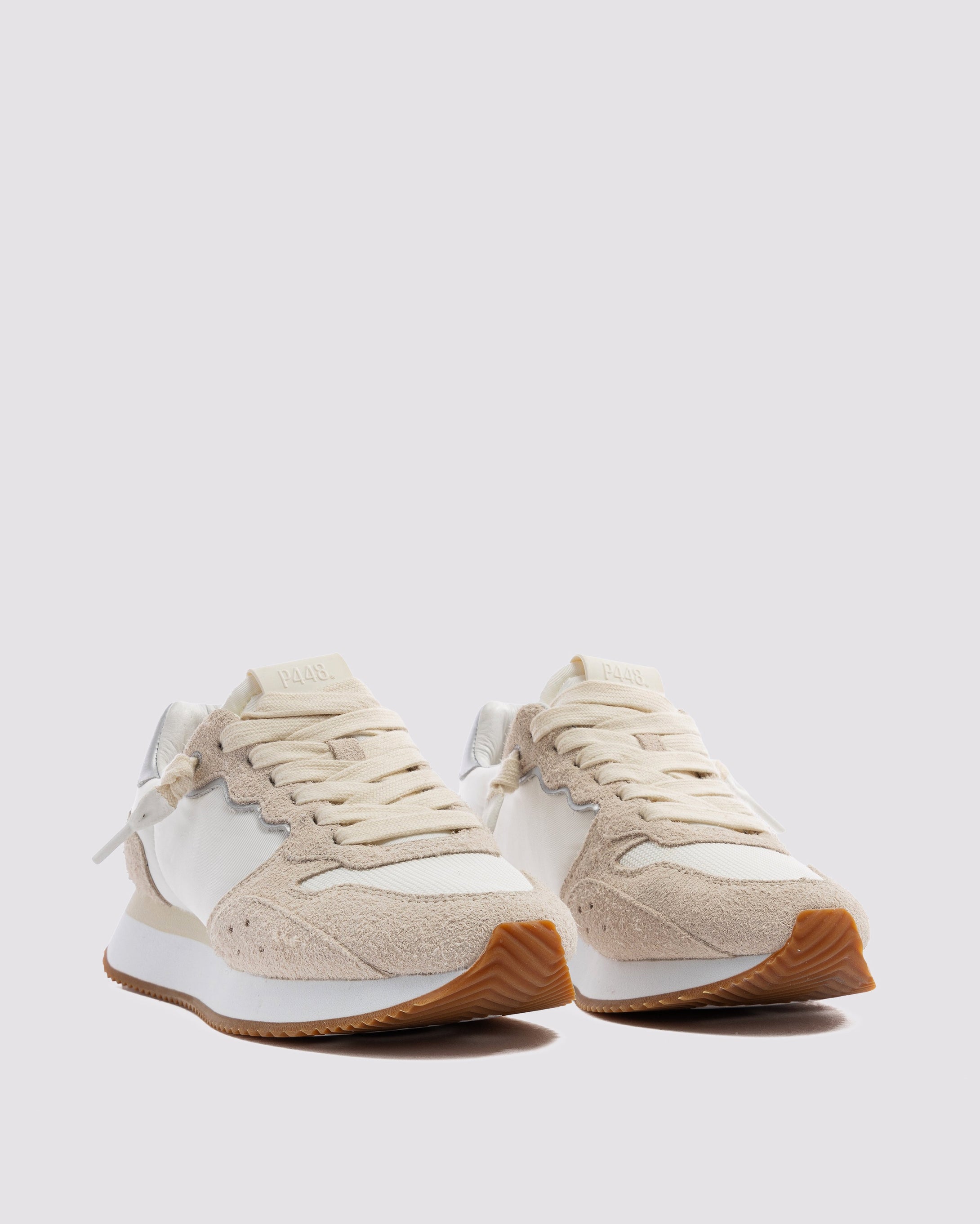 Side angle of light pink and white sneakers