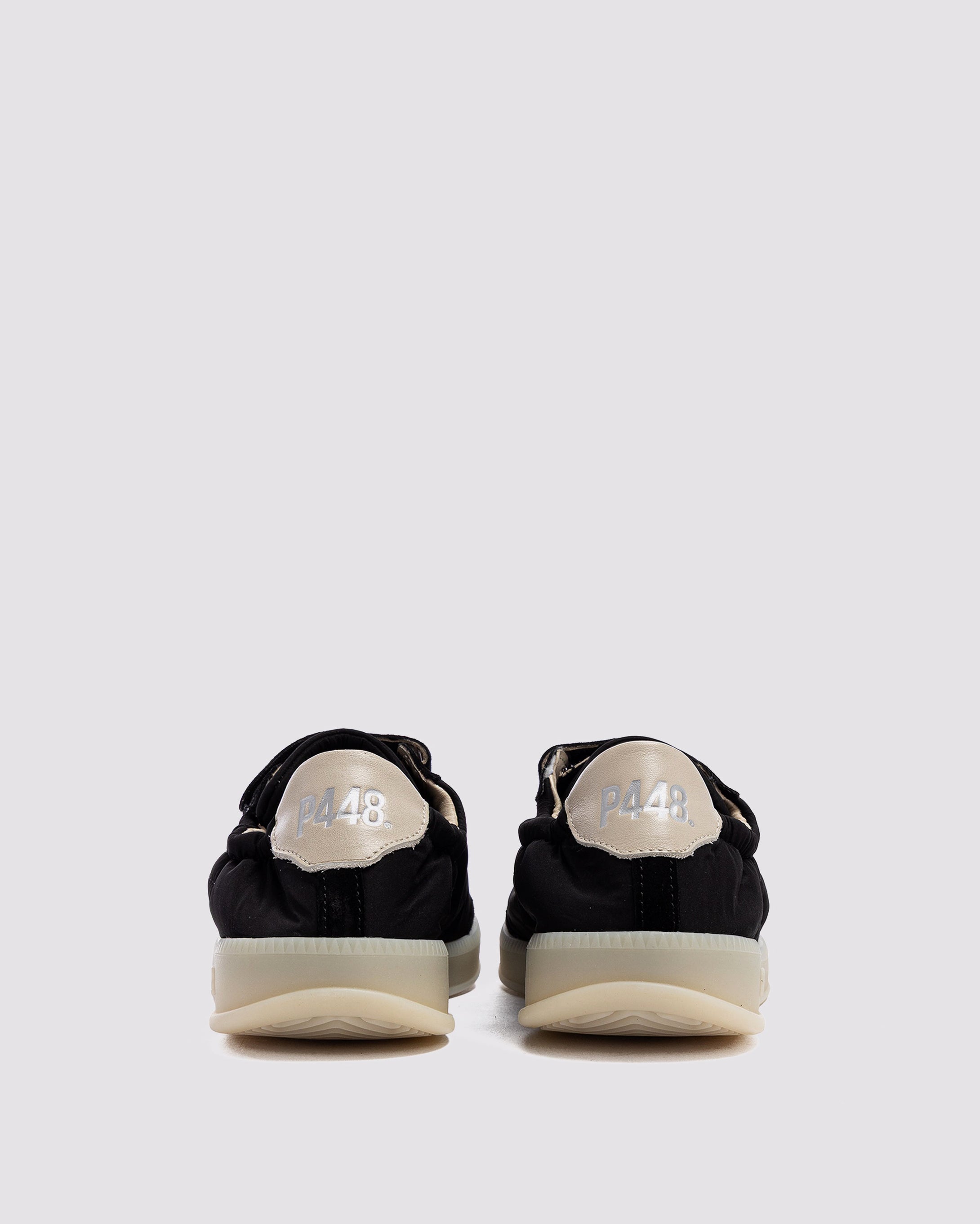 Side angle of nylon black sneakers