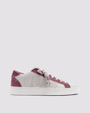 Side angle of white and pink sneakers