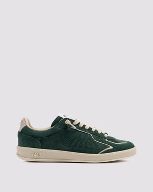 Side angle of green and white sneakers