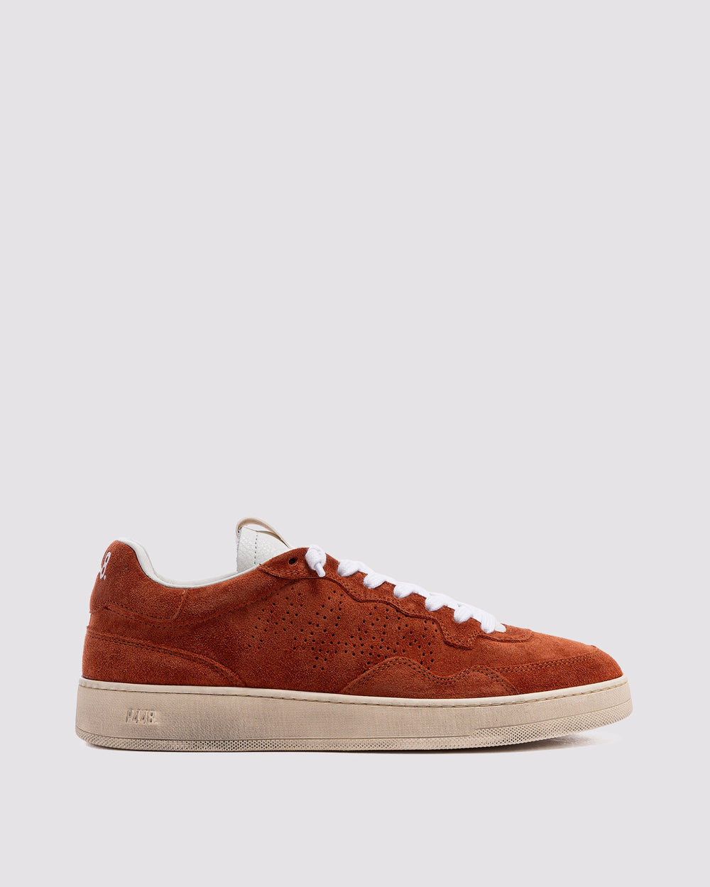 Side angle of mono orange and orange sneakers