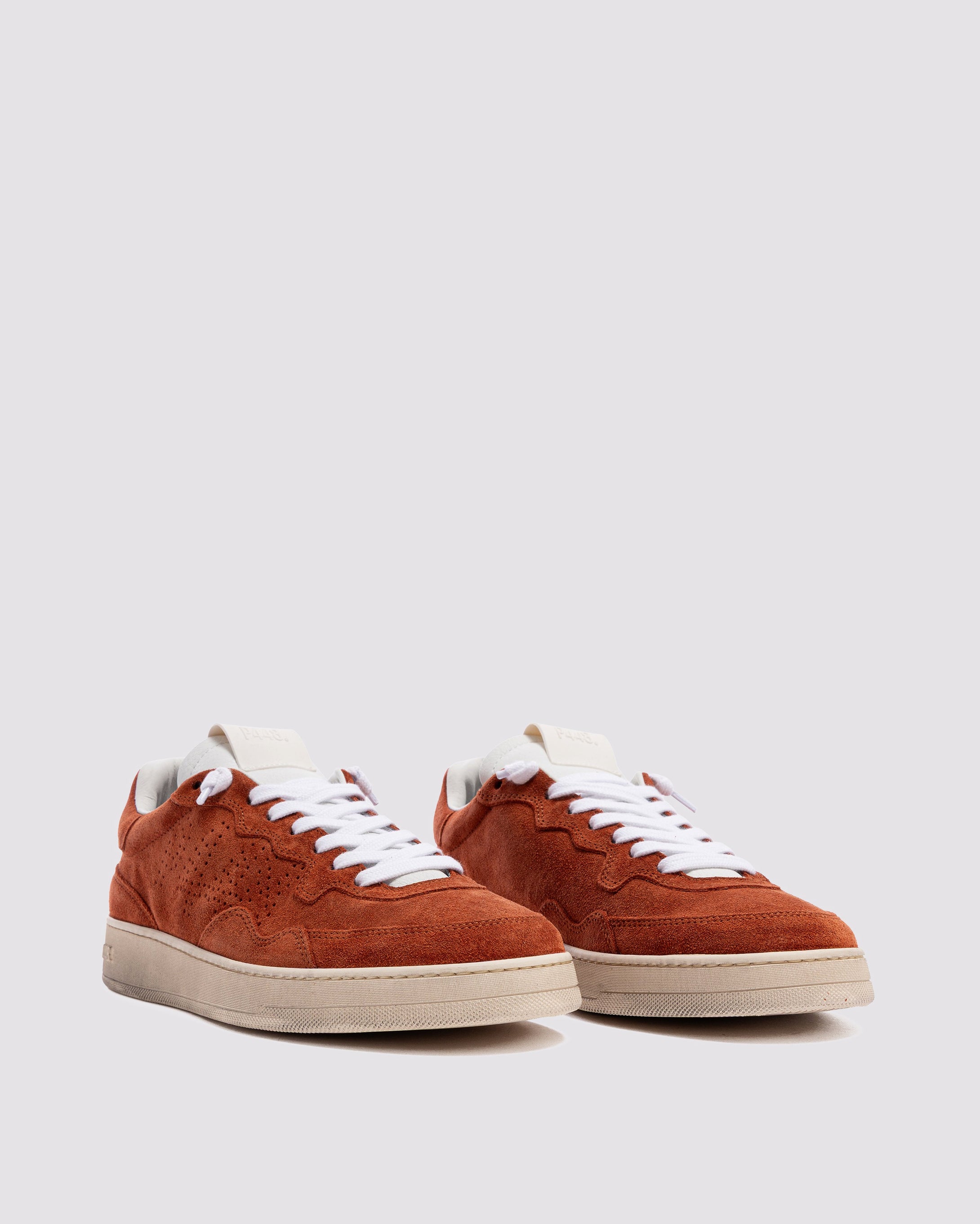 Side angle of mono orange and orange sneakers