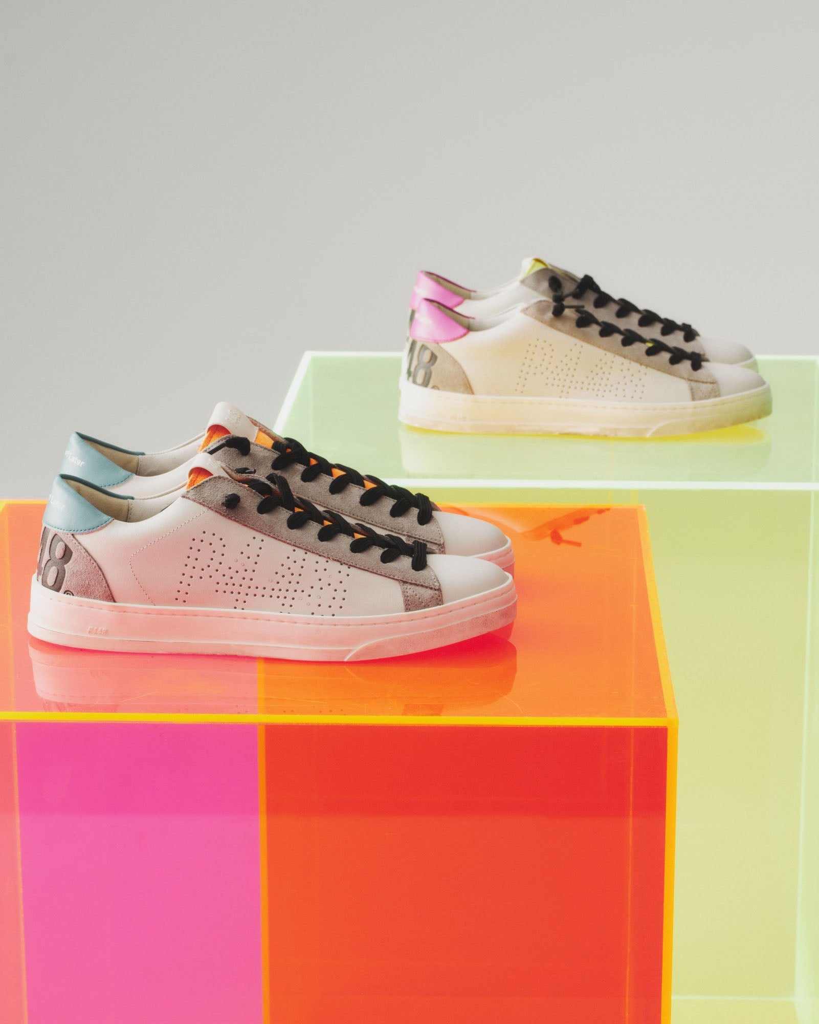 Side angle of white and blue sneakers