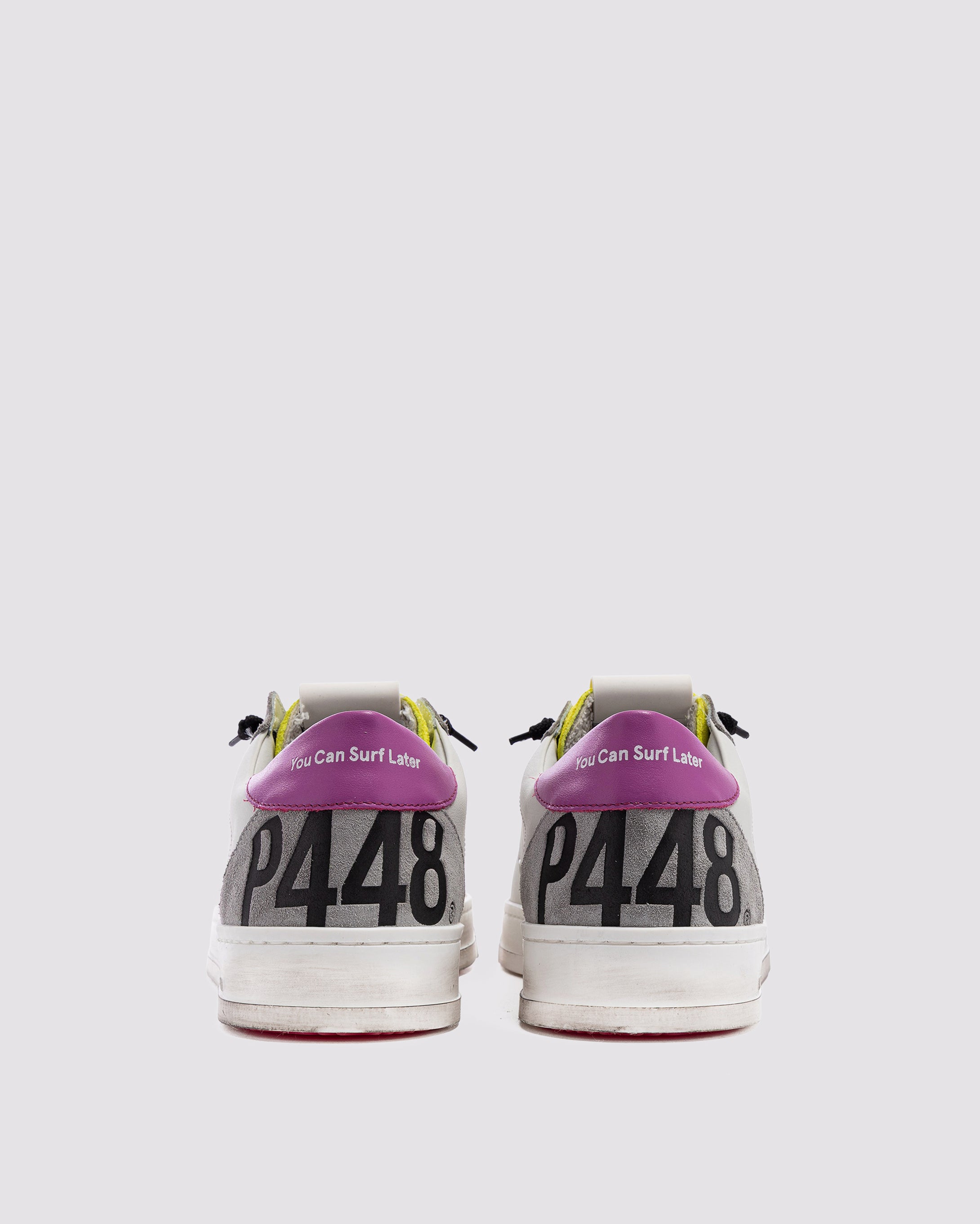 Side angle of white, pink and yellowsneakers